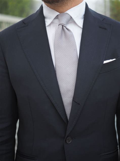blue suit with silver tie